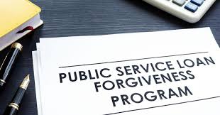 Public Service Loan Forgiveness Program document with pen and calculator