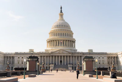 U.S. Capitol Building in Washington D.C. with clear sky and pedestrian walkway