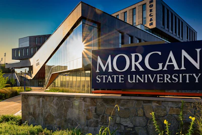 Morgan State University campus sign with modern building architecture against blue sky